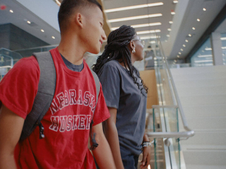 Two students walking up stairs in Kiewit Hall